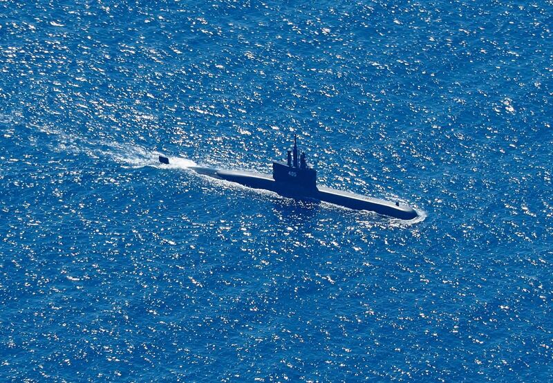 An aerial photo shows Indonesian Navy submarine KRI Alugoro sailing on a search mission for KRI Nanggala. EPA