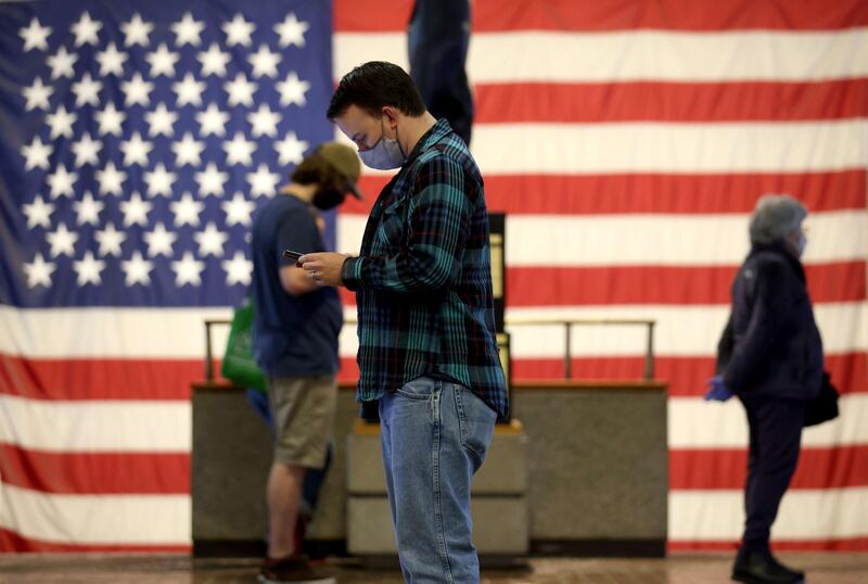 People wait in line to vote at the Montgomery County Executive Office Building in Rockville, Maryland. Today marks the first day of early in-person voting in the state of Maryland.   AFP