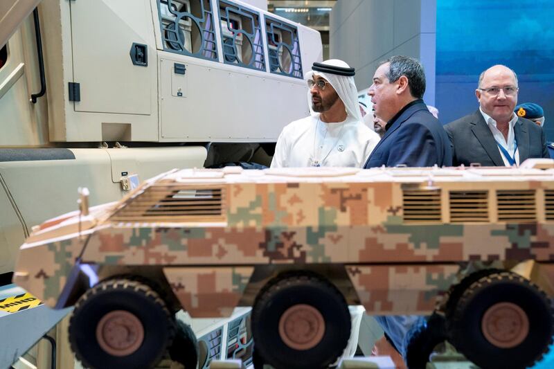 ABU DHABI, UNITED ARAB EMIRATES - February 20, 2019: HH Sheikh Mohamed bin Zayed Al Nahyan, Crown Prince of Abu Dhabi and Deputy Supreme Commander of the UAE Armed Forces (L) visits Paramount Group stand, during the 2019 International Defence Exhibition and Conference (IDEX), at Abu Dhabi National Exhibition Centre (ADNEC).
( Ryan Carter for the Ministry of Presidential Affairs )
---