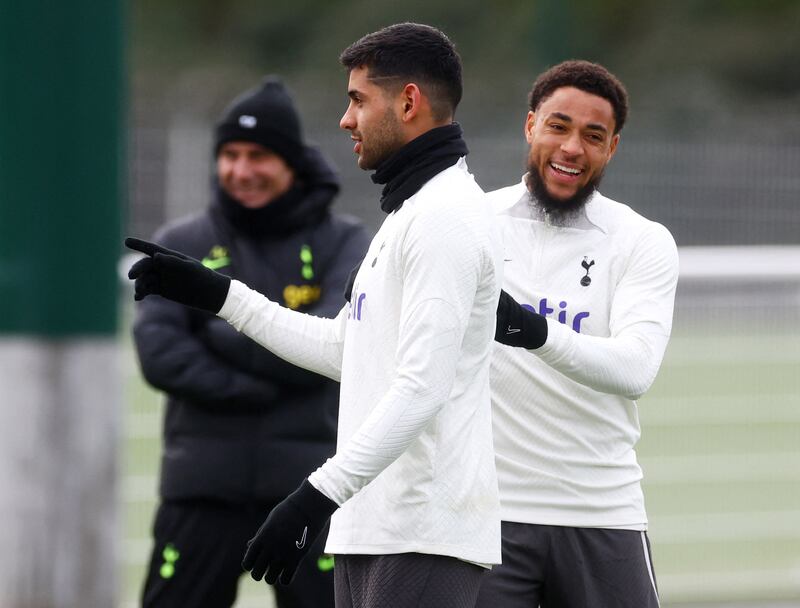 Tottenham Hotspur's Cristian Romero, centre, and Arnaut Danjuma during training. Reuters