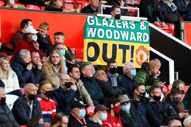 United fans with banner protesting against the club's owners and former executive vice-chairman at Old Trafford. PA