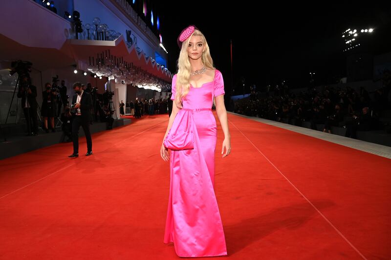 Anya Taylor-Joy, in bright pink Dior Haute Couture, attends the red carpet for 'Last Night In Soho' during the 78th Venice International Film Festival on September 04, 2021. Getty Images