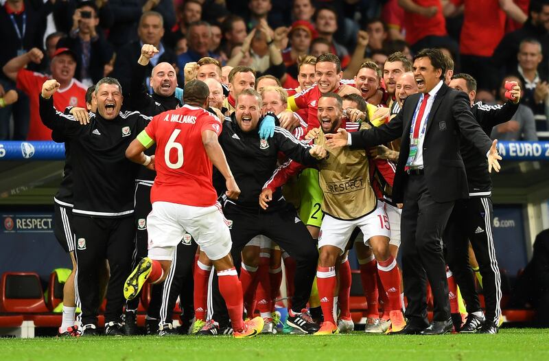 Welsh manager Chris Coleman celebrates with Ashley Williams after he scored his team's first goal during the Euro 2016 quarter-final against Belgium in Lille, France. 