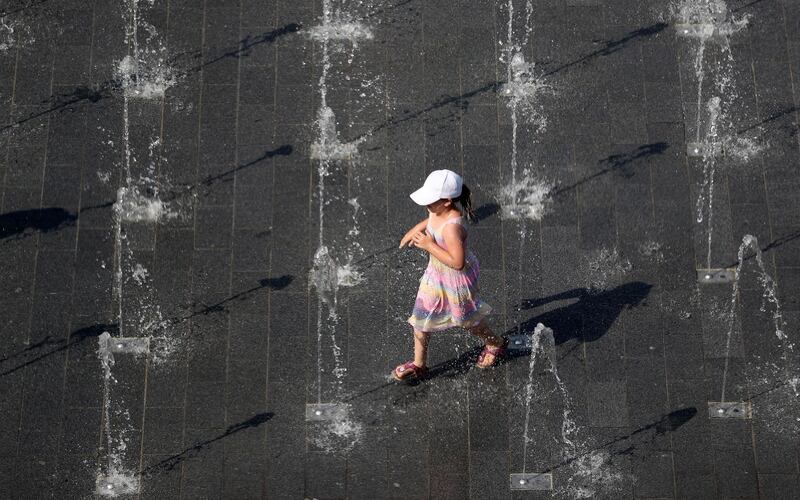 A child plays at a fountain in Duisburg, Germany.  EPA