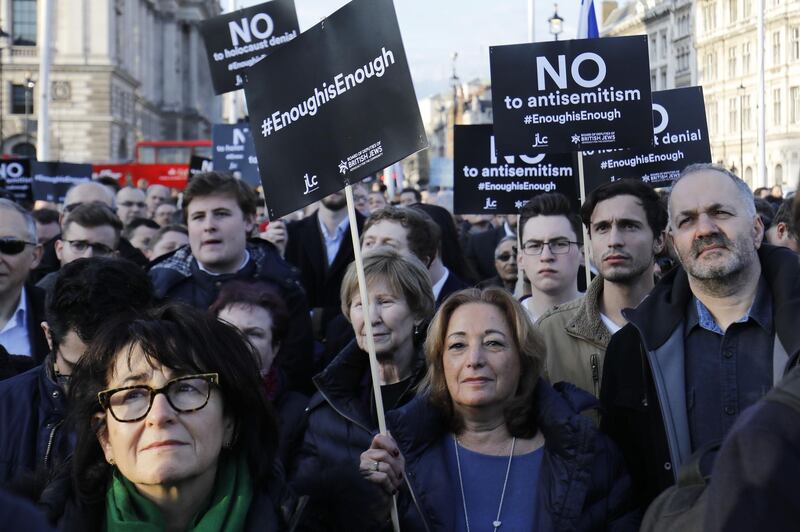 (FILES) In this file photo taken on March 26, 2018 members of the Jewish community hold a protest against Britain's opposition Labour party leader Jeremy Corbyn and alleged anti-semitism in the Labour party, outside the British Houses of Parliament, in central London on March 26, 2018. British police announced November 2, 2018 they were investigating alleged "anti-Semitic hate crimes" within the main opposition Labour Party after receiving a leaked internal dossier. / AFP / Tolga AKMEN
