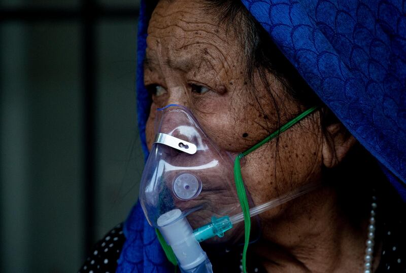 A Covid-19 patient is being treated outside of a hospital in Kathmandu, Nepal. EPA