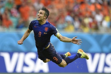 Netherlands' forward Robin van Persie scores during a Group B football match between Spain and the Netherlands at the Fonte Nova Arena in Salvador during the 2014 FIFA World Cup on June 13, 2014. AFP PHOTO / LLUIS GENE
