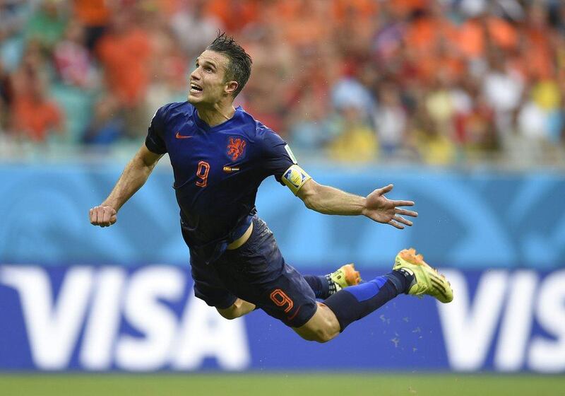 Netherlands' forward Robin van Persie scores a diving header in the group-stage match against Spain at the 2014 World Cup in Brazil. AFP 