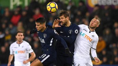 Fernando Llorente of Tottenham Hotspur, centre, wins a header during the Premier League match against Swansea City. The Spaniard scored the opening goal in a 2-0 win against his former club. Stu Forster / Getty Images