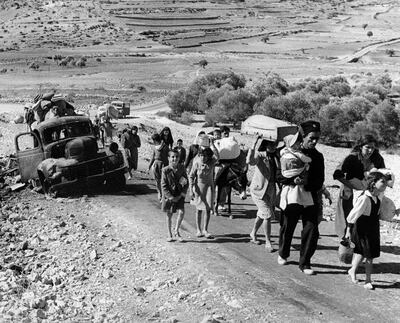 Arab refugees stream from Palestine on the Lebanon Road, Nov. 4, 1948. These are Arab villagers who fled from their homes during the recent fighting in Galilee between Israel and Arab troops. (AP / Jim Pringle)