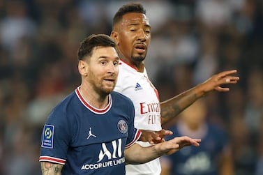 Paris Saint-Germain's Lionel Messi (L) and Lyon's Jerome Boateng (R) react during the French Ligue 1 soccer match between Paris Saint-Germain (PSG) and Olympique Lyonnais in Paris, France, 19 September 2021 (issued on 20 September 2021).   EPA / IAN LANGSDON