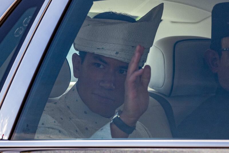 Prince Abdul Mateen waves following his solemnisation. AFP