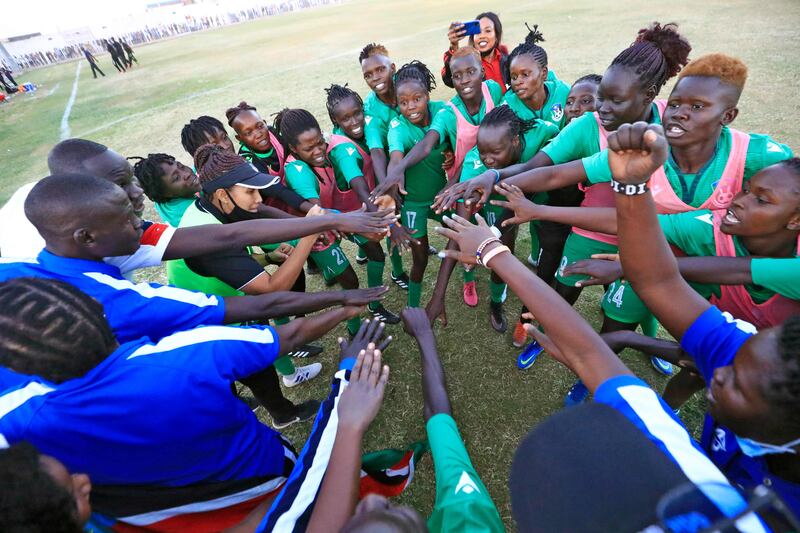 Members of South Sudan's women's football team huddle during a friendly match against Sudan at Jebel Awliaa stadium, in Khartoum. AFP