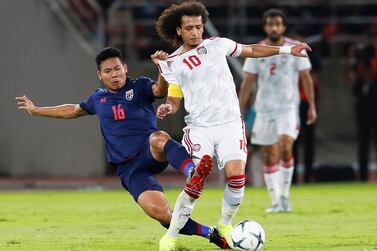 epa07922647 Omar Abdulrahman (R) of the UAE in action against Thailand's Phitiwat Sookjitthammakul (L) during the FIFA World Cup 2022 qualifying group G soccer match between Thailand and the United Arab Emirates (UAE) at Thammasat Stadium in Bangkok, Thailand, 15 October 2019. EPA/RUNGROJ YONGRIT