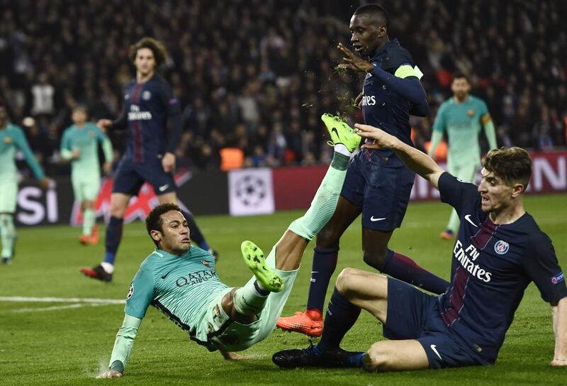 Barcelona's Neymar is tackled by Paris Saint-Germain's Thomas Meunier. Christophe Simon / AFP