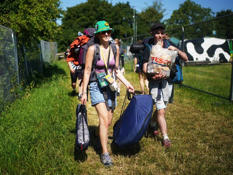 Guests arrive as the sun shines. Reuters