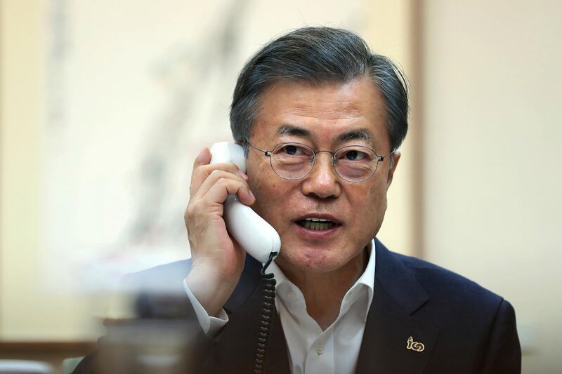 In this photo provided by South Korea Presidential Blue House, South Korean President Moon Jae-in talks on the phone with U.S. President Donald Trump at the presidential Blue House in Seoul, South Korea, Thursday, Feb. 28, 2019. South Korea described the breakdown of nuclear talks between U.S. President Donald Trump and North Korean leader Kim Jong Un on Thursday as unfortunate, but expressed hope that the two countries can continue an active dialogue. (South Korea Presidential Blue House via AP)