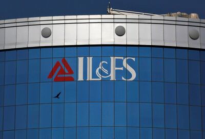 FILE PHOTO: A bird flies next to the logo of IL&FS (Infrastructure Leasing and Financial Services Ltd.) installed on the facade of a building at its headquarters in Mumbai, India, September 25, 2018. REUTERS/Francis Mascarenhas/File Photo