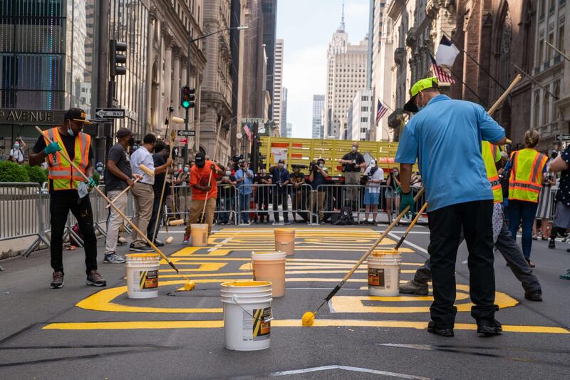 Crews begin painting a Black Lives Matter mural on Fifth Avenue directly in front of Trump Tower in New York City. Getty Images/AFP