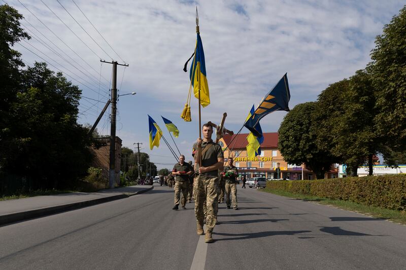 A sombre funeral ceremony for a Ukrainian soldier killed in Polonne, Khmelnytskyi region. AP