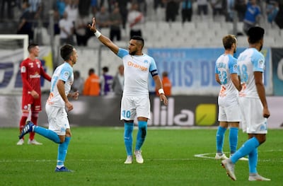 Marseille's French midfielder Dimitri Payet (C) celebrates after  scoring a penalty kick  during the French L1 football match between Marseille (OM) and Strasbourg (RCSA) at the Velodrome stadium in Marseille on September 26, 2018.  / AFP / GERARD JULIEN
