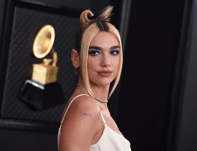 FILE - This Jan. 26, 2020 file photo shows Dua Lipa at the 62nd annual Grammy Awards in Los Angeles. Dua Lipa released her sophomore album "Future Nostalgia" on March 27. Female British stars Dua Lipa, Arlo Parks and Celeste lead the competition for the Brit Awards which were announced Wednesday, March 31, 2021, with a trio of nominations apiece for the U.K. music prizes. Lipa is also up for best British single, for â€œPhysical.â€ Parks and Celeste are contenders for the breakthrough artist trophy. (Photo by Jordan Strauss/Invision/AP, File)