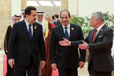 Left to right, Iraq's Prime Minister Mohammed Shia Al Sudani, Egyptian President Abdel Fattah El Sisi and Jordan's King Abdullah at the conference. AP