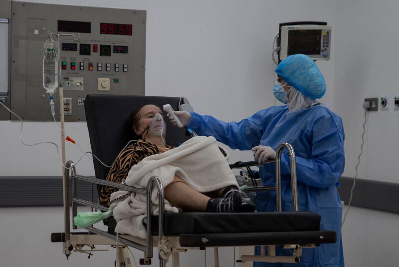 A nurse treats a Covid-19 patient in the intensive care unit at Rafic Hariri University Hospital in Beirut, Lebanon. EPA