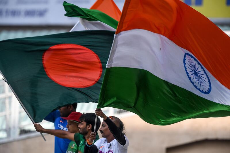 India and Bangladesh fans attend the practice session at the Eden Gardens on the eve of the first pink-ball Test between the two teams in Kolkata. AFP