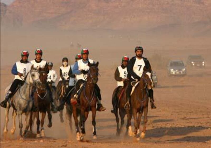 Dubai ruler Sheikh Mohammed bin Rashed al-Maktoum (R), who is also Emirati vice president and prime minister, takes part in a horse endurance race along with his sons in the Jordanian desert of Wadi Rum on November 14, 2008. AFP PHOTO/AWAD AWAD *** Local Caption ***  707189-01-08.jpg