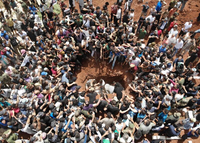 A picture taken with a drone on June 9, 2019 shows Syrians attending the burial of late rebel fighter Abdel-Basset al-Sarout in al-Dana in Syria's rebel-held Idlib region, near the border with Turkey. AFP