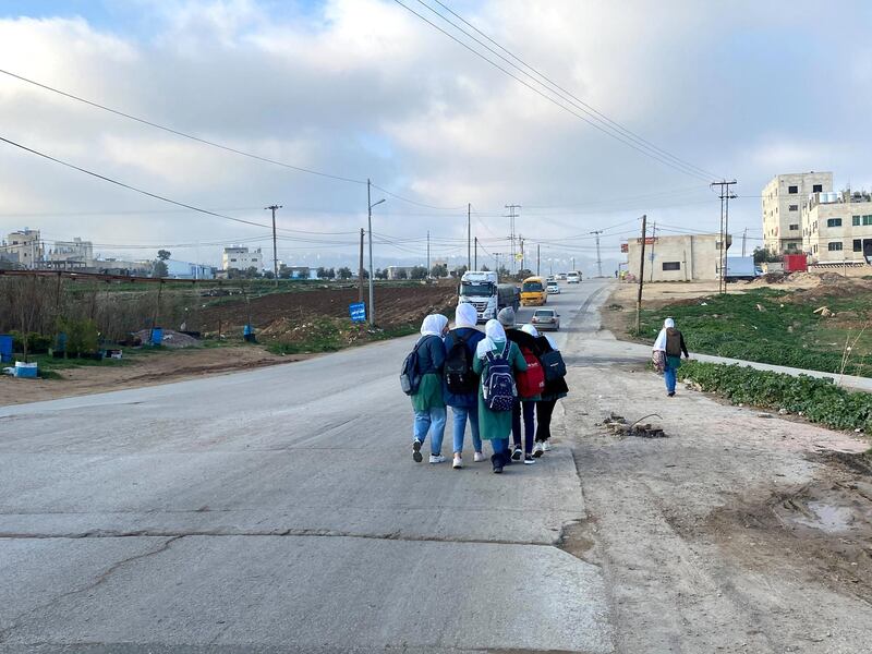 Teenagers in Al Baqa’a camp make their way to school, after months of closures due to Covid-19. Amy McConaghy/ The National