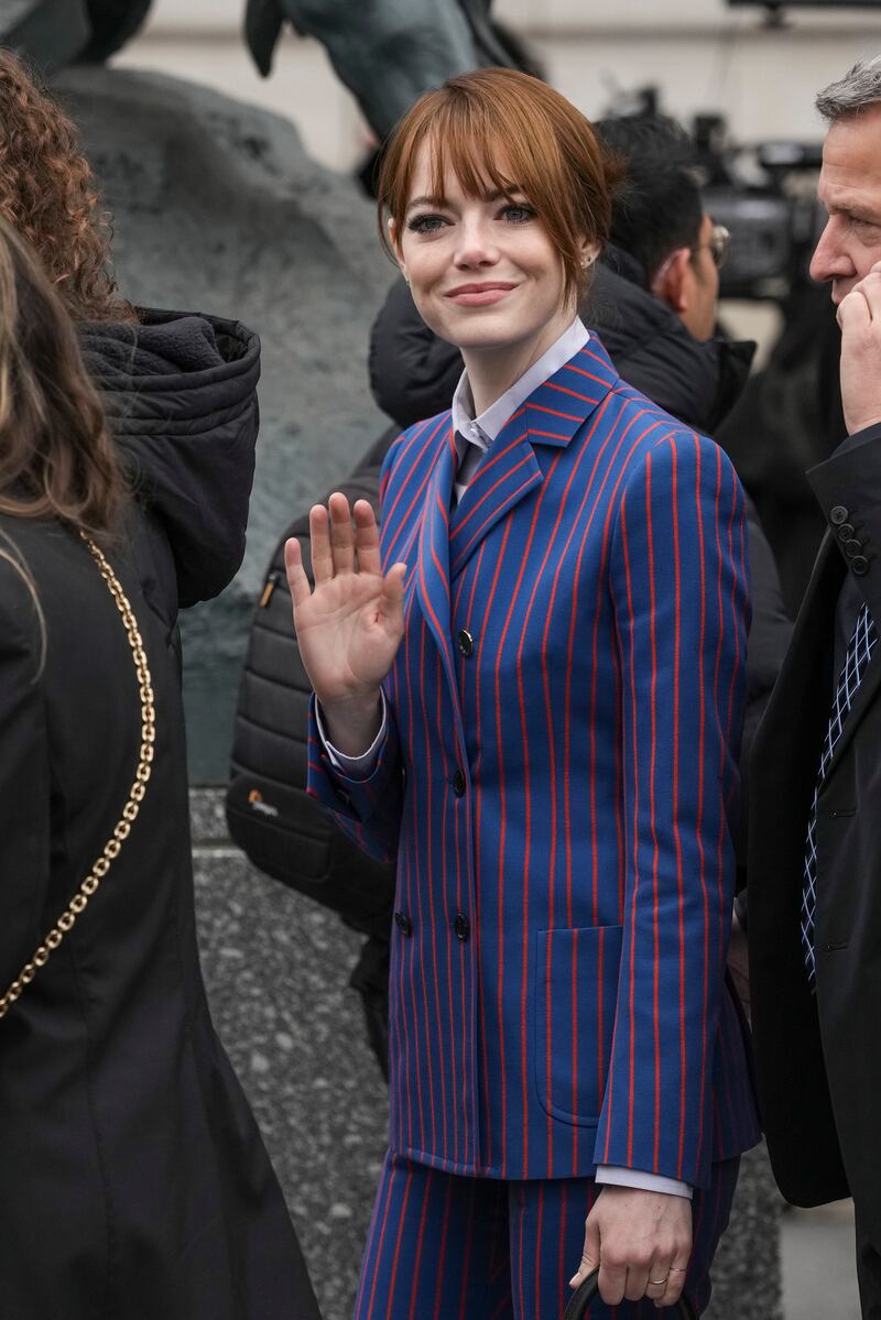 Emma Stone arrives at the Louis Vuitton show. AP