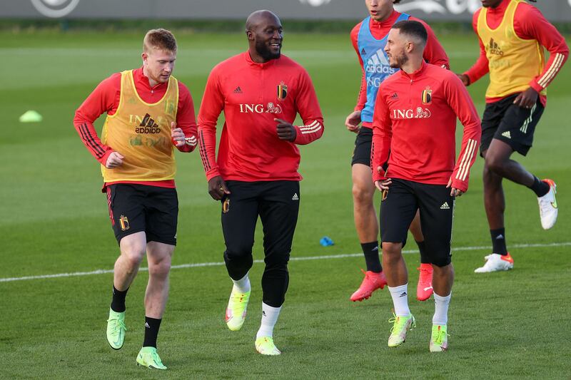 Kevin De Bruyne, Romelu Lukaku and Eden Hazard warm up during a training session. AFP