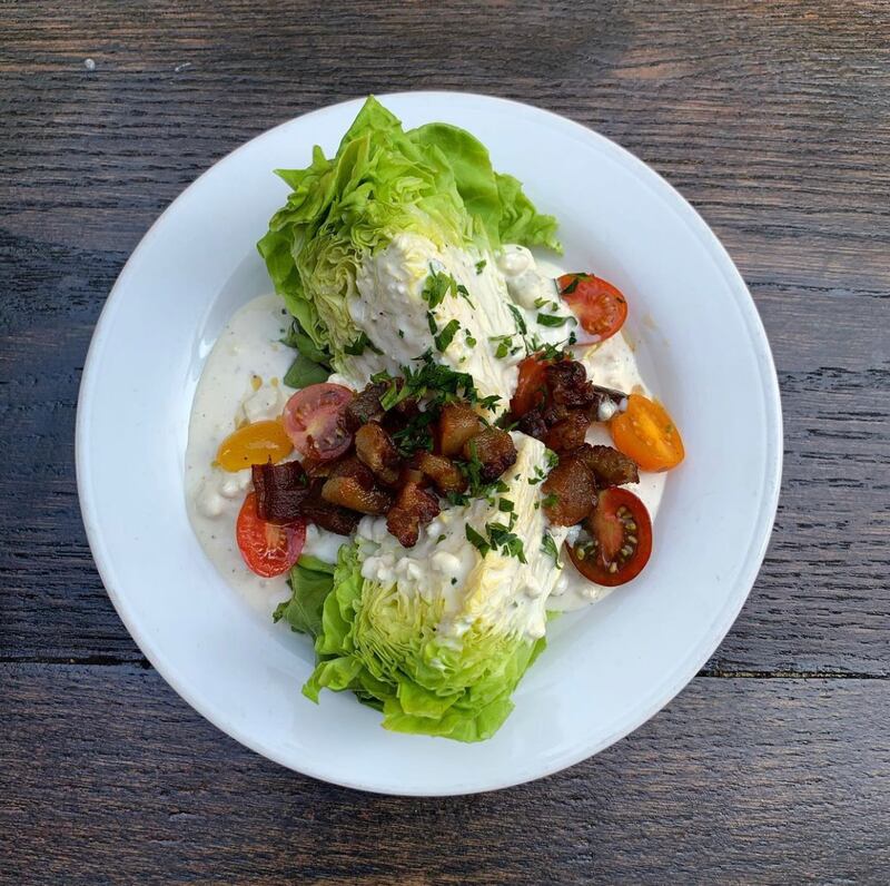 The wedge salad features lettuce from the restaurant's rooftop aeroponic towers.