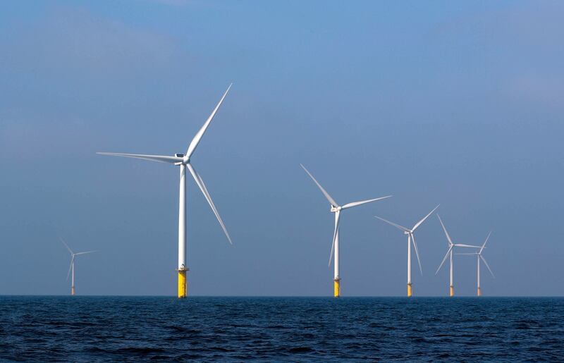 Power-generating windmill turbines at an offshore wind farm near Amsterdam, the Netherlands. Reuters