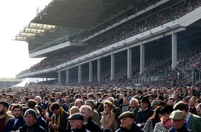 File photo dated 13-03-2020 of Crowds in the stands during day four of the Cheltenham Festival at Cheltenham Racecourse. PA Photo. Issue date: Wednesday April 22, 2020. The decision to suspend professional football in England before the Government formally banned mass gatherings due to the coronavirus pandemic was a potential lifesaver, according to an epidemiologist. See PA story SPORT Coronavirus  Epidemiologist.  Photo credit should read Andrew Matthews/PA Wire.