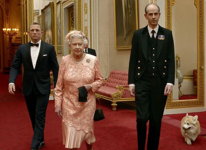 During famous scenes from the London 2012 Olympics opening ceremony, the queen was filmed walking alongside James Bond in Buckingham Palace — with a corgi following closely. AFP