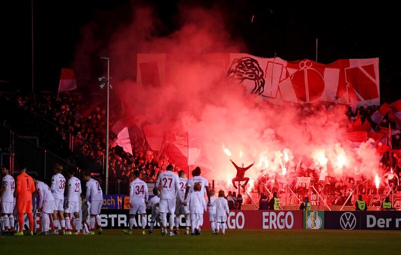Fans let off flares before the DFB Cup second round match between Saarbrucken and FC Koln at Ludwigspark Stadion in Germany on Tuesday, October 29. Getty