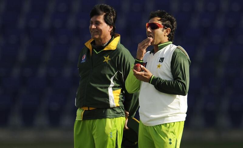 Pakistan's Saeed Ajmal is licking his fingers in anticipation. Philip Brown / Reuters