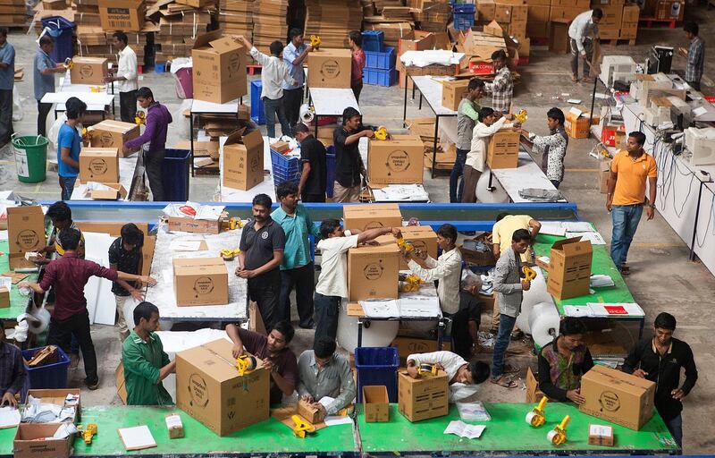 05 Nov 2015 - Bhiwandi - INDIA.
Workers work overtime to dispatch purchased goods to customers  to meet the huge Diwali sales at  Snapdeal's Fulfillment centre at Bhiwandi on the out skirts of Mumbai.

(Subhash Sharma for The National) *** Local Caption ***  DiwaliOnline (11).jpg