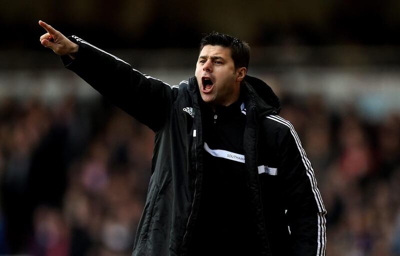 Southampton manager Mauricio Pochettino shouts instructions during the Premier League match against West Ham at the Boleyn Ground on February 22, 2014. Ben Hoskins / Getty Images