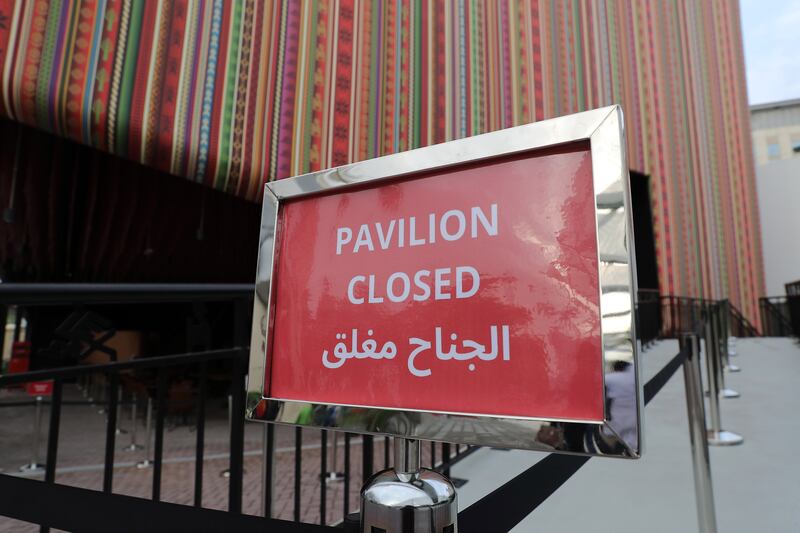 'Pavilion closed' sign at the entrance of the Peru pavilion because of rain damage.