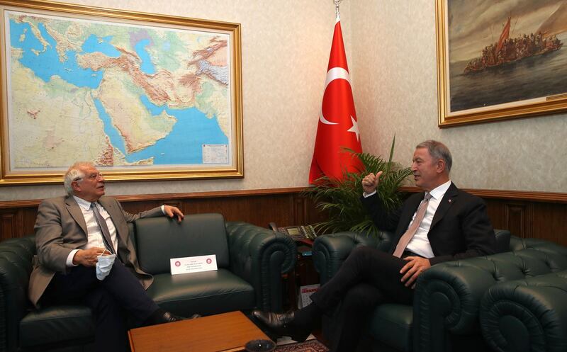 Josep Borrell Fontelles, High RepresentativeÂ and Vice-PresidentÂ of the European Commission, left, and Turkey's Defense Minister Hulusi Akar speak during a meeting in Ankara, Turkey, Monday, July 6, 2020. Turkey's Foreign Minister Mevlut Cavusoglu on Monday called on the European Union to be an "honest broker" in disputes between Turkey and EU member states France, Greece and Cyprus, warning that his country would be forced to "reciprocate" against any decisions the bloc takes against Ankara.(Turkish Defense Ministry via AP, Pool)