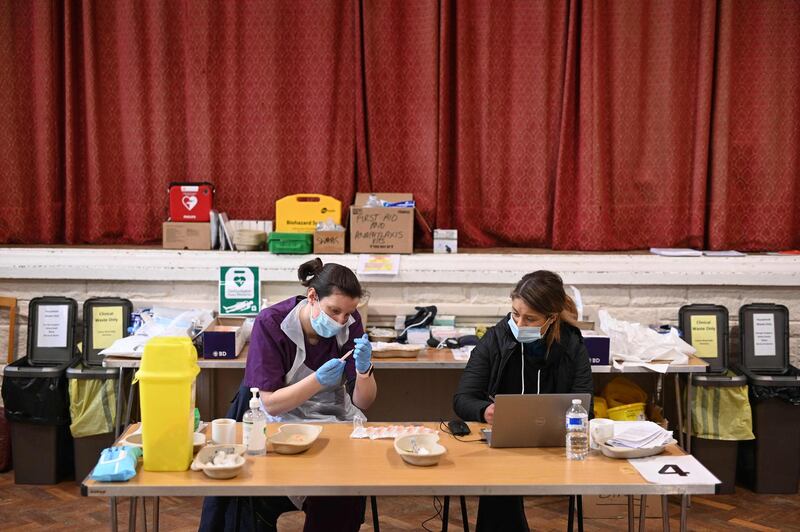 Doctor Kate Martin prepares dosed of the  vaccine at the vaccination centre set up at St Columba's church in Sheffield. AFP