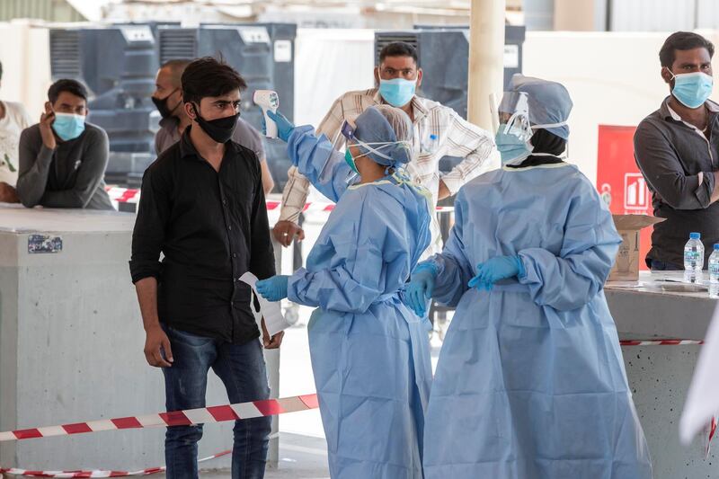 ABU DHABI, UNITED ARAB EMIRATES. 16 APRIL 2020. COVID-19 Testing station in Al Mussafah. Medical staff pre-check individuals ahead of the actual COVID-19 test. (Photo: Antonie Robertson/The National) Journalist: Haneen Dajani. Section: National.