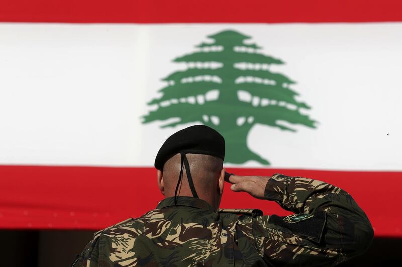 A special forces officer salutes the Lebanese flag during a military parade to mark the 76th anniversary of the country's independence from France at the Lebanese Defense Ministry, in Yarzeh near Beirut, Lebanon. AP Photo