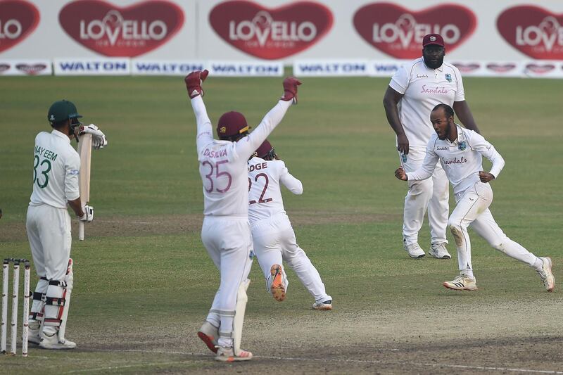 West Indies' captain Kraigg Brathwaite, right, celebrates the dismissal of Bangladesh's Nayeem Hasan. AFP