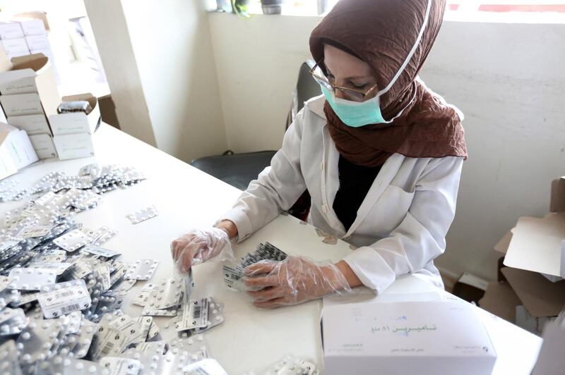 A laboratory technician packs Azithromycin tablets at Syrian Tamico Pharmaceutical Factory. Youssef Badawi / EPA