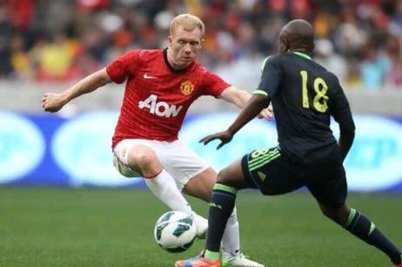 Paul Scholes, in action during Manchester United's pre-season tour of South Africa last week, has been with the club since he was 14. Luke Walker / Getty Images